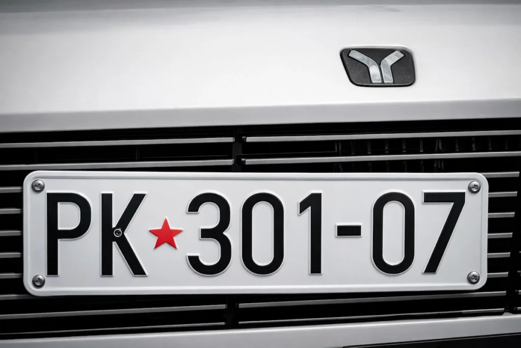 A photo of a newly installed license plate on a new van.