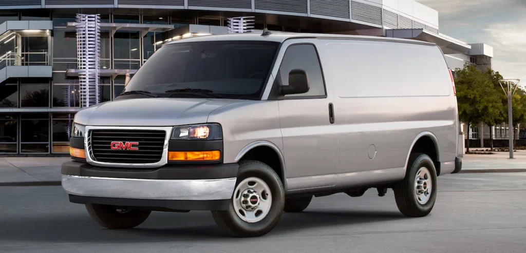 A photo of a GMC Savana low-roof cargo van.